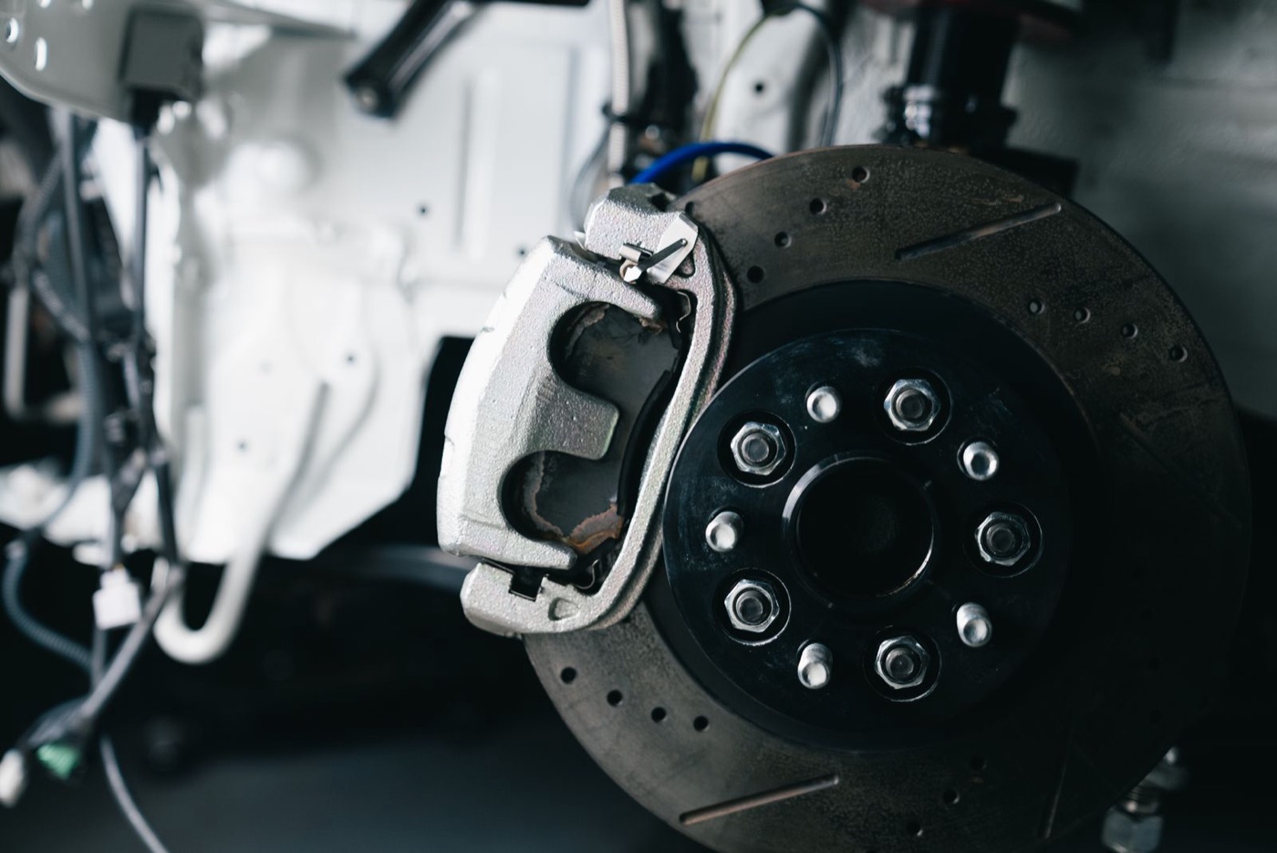 Close-up of a brake caliper and disc